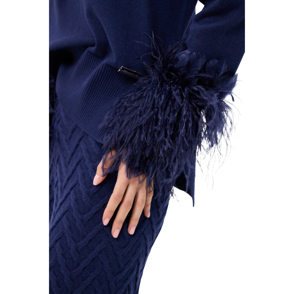 The Polo Neck Sweater With Feather Cuffs