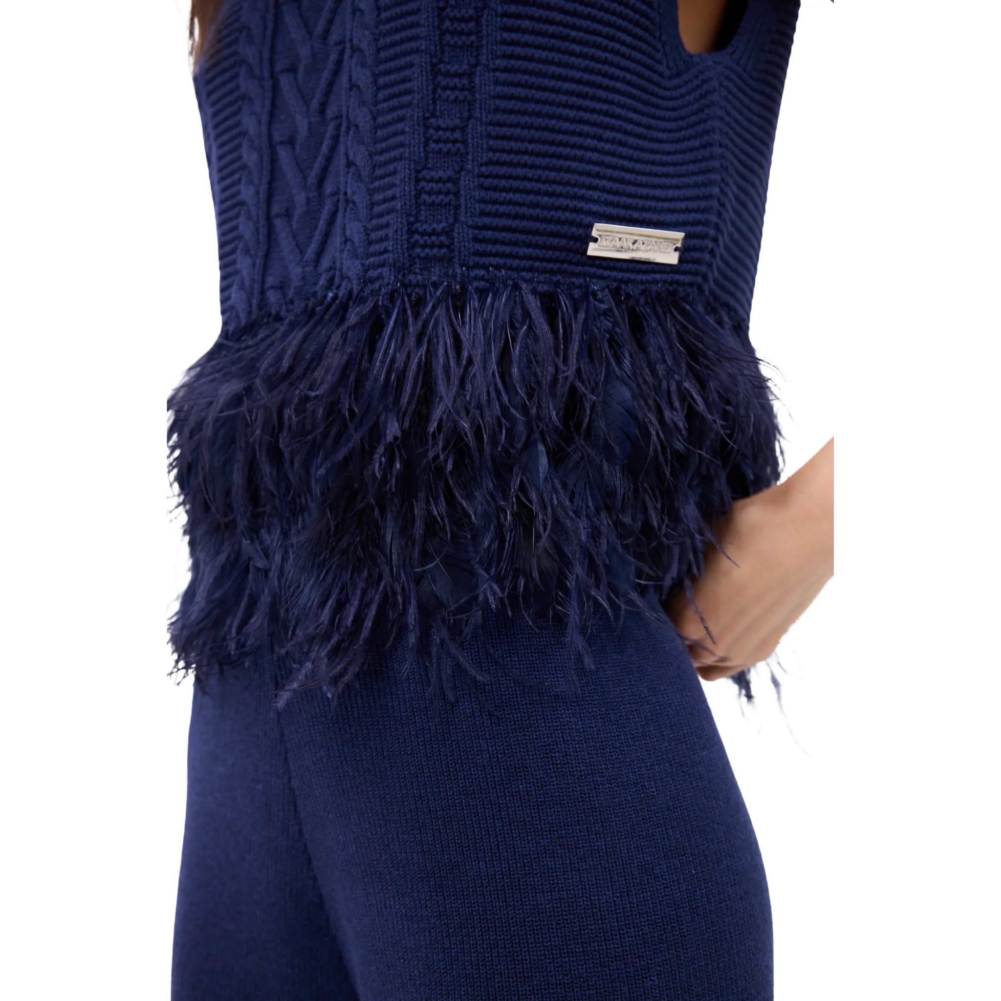 The Sleeveless Polo Neck With Feather Trim