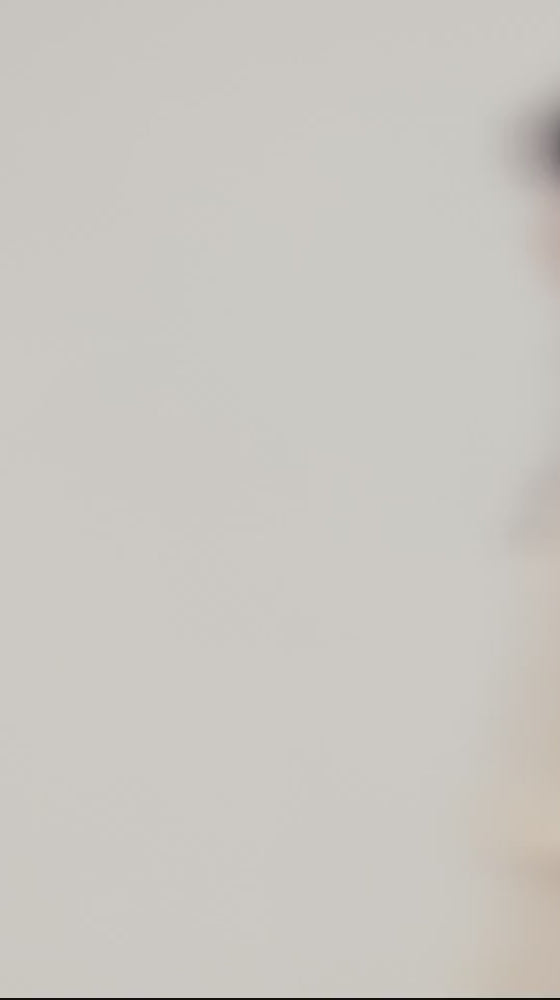 The Pleated Mini Dress with Ruffle Detail in Meringue