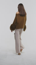 Load and play video in Gallery viewer, Criss-Cross Sweater with Shearling Cuffs in Monk
